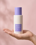 Hand holding the 125g Tighten and Smooth Belly Cream jar showing its true size
