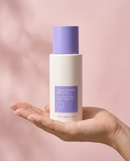 Hand holding the 125g Tighten and Smooth Belly Cream jar showing its true size